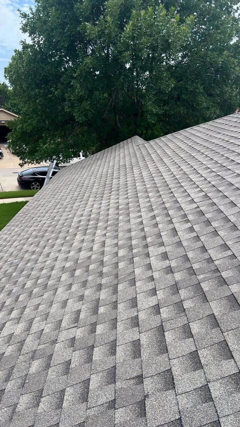 New shingles across intersecting roof slopes