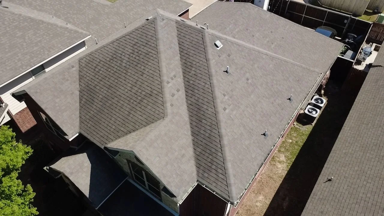 Existing shingles on the Red Oak property before replacement