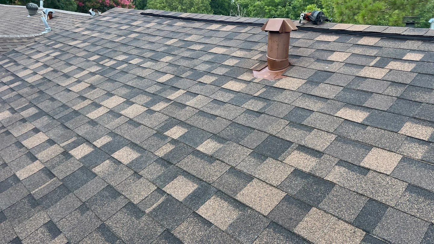 Multitone shingles with ridge vent and roof vent